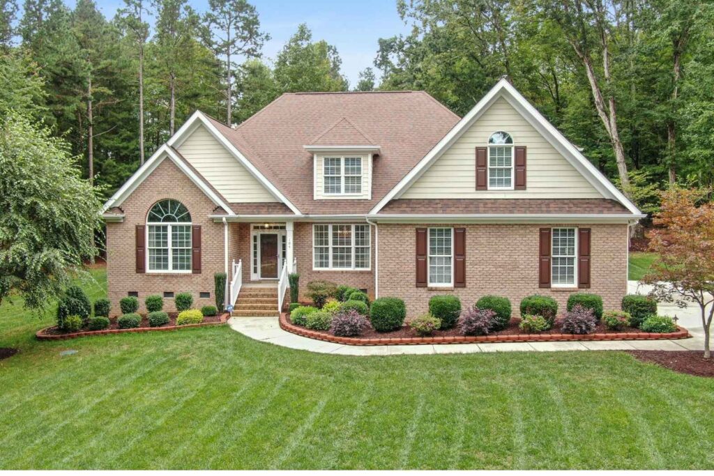Sell house as is Alpharetta GA – brick two-story home with landscaped yard, ready for quick cash sale